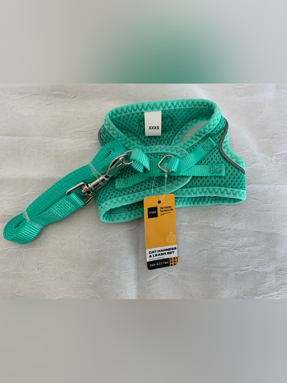 Fida Cat Harness and Leash Set in turquoise.